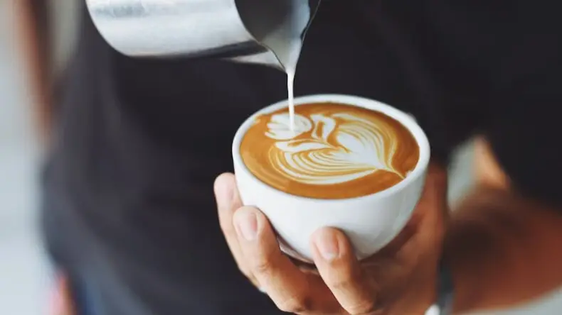 Coffee beans with a cup of coffee