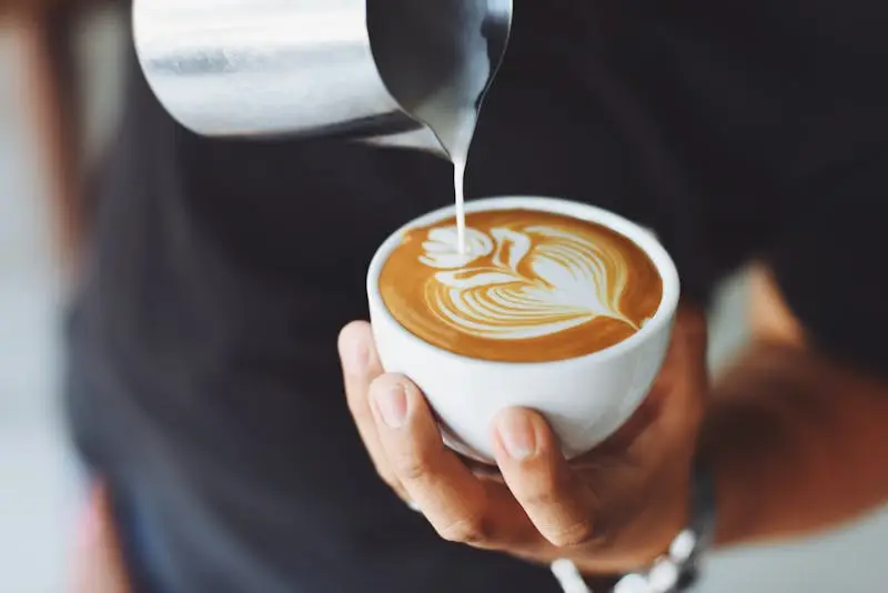Coffee beans with a cup of coffee